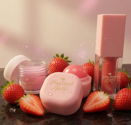 Strawberry Bomb S-Bomb Elevate Bundle featuring skincare products and fresh strawberries.